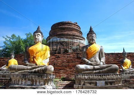 Ancient buddha statues and ruined pagoda at Wat Yai Chai Mongkol in Ayutthaya historic attractionsThailand