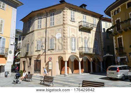 People Walking And Sitting At Varallo Sesia Village