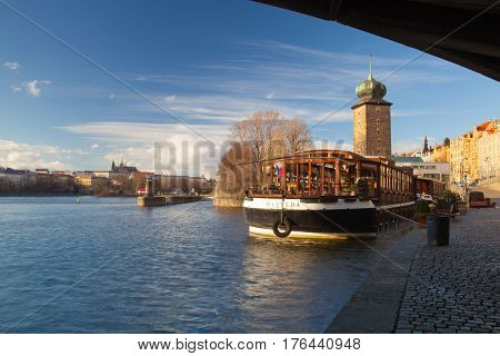Prague Czech Republic - March 3 2017: Ristorante Botel Matylda on the Vltava river. This romantic dining spot is located on a boat in the river Vltava and serves Italian food with beautiful views of Prague Castle.