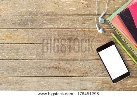 Notebooks and cup of coffee with smart phone on office desk or wood table. top view with copy space for design