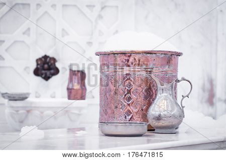 Water Jar And Copper Bowl With Soap Foam In Turkish Hamam. Traditional Interior Details