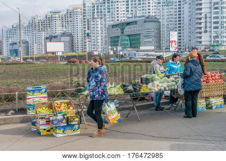 KYIV, UKRAINE - MARCH 15, 2017: People on local market near metro station Poznyaky, Kyiv. Ukraine is agricultural country.
