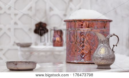 Water Jar And Copper Bowl With Soap Foam In Turkish Hamam. Traditional Interior Details