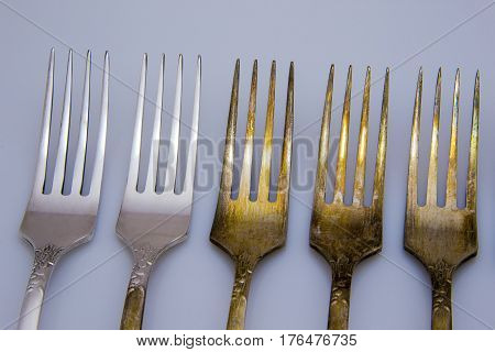 old metal fork with knife and spoon isolated on a white background