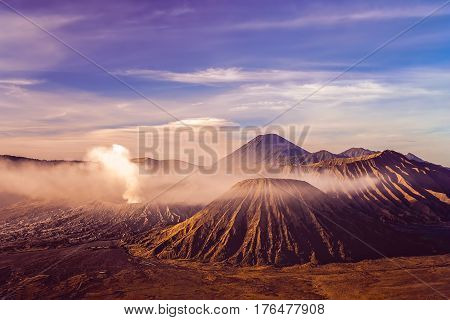 Early morning after sunrise view of the spectacular Gunung Bromo and Sumeru volcanoes in Java Indonesia