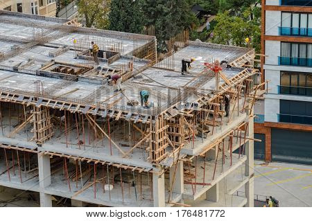 Istanbul Turkey - November 09 2016: Construction site workers working on the top of a building under construction