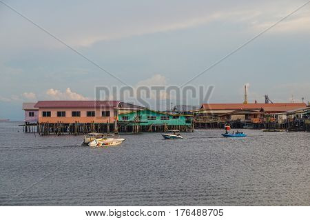 Labuan,Malaysia-March 15,2017:Evening scene of daily activities at Patau-Patau water village in Labuan,Malaysia.Patau-Patau water village is among famous place in Labuan Pearl Of Borneo,Malaysia.