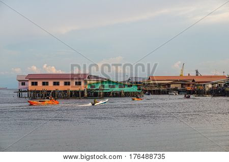 Labuan,Malaysia-March 15,2017:Evening scene of daily activities at Patau-Patau water village in Labuan,Malaysia.Patau-Patau water village is among famous place in Labuan Pearl Of Borneo,Malaysia.
