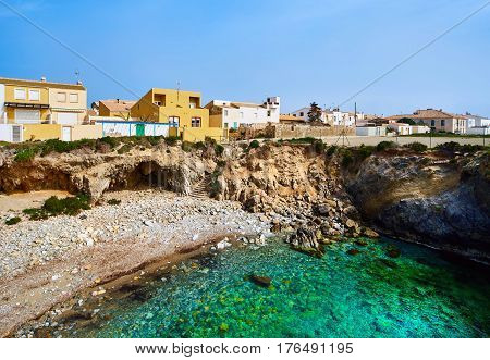 Rocky coastline of Tabarca Island. Crystal-clear turquoise water. Province of Alicante. Spain