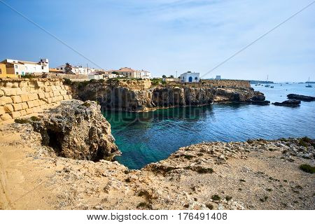 Rocky coastline of Tabarca Island. Crystal-clear turquoise water. Province of Alicante. Spain