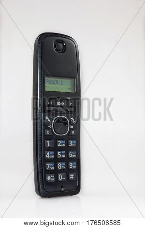 Handset radio telephone on a white table