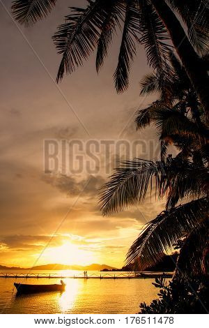 Colorful sunset at Nananu-i-Ra Island Fiji. Tourism is the main industry of Nananu-I-Ra