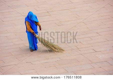 Woman Sweeping Jaleb Chowk - Main Courtyard Of Amber Fort, Rajasthan, India