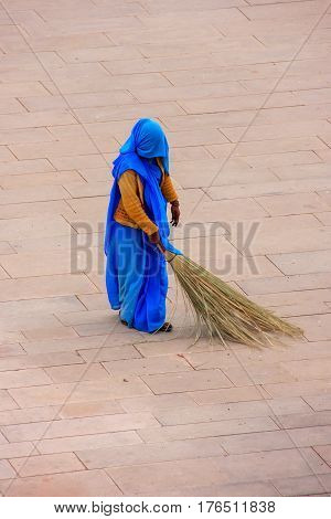 Woman Sweeping Jaleb Chowk - Main Courtyard Of Amber Fort, Rajasthan, India
