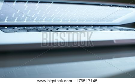Abstarct closeup angle laptop half close with white screen .seleted focus.