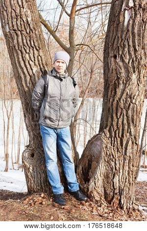 The Man In Spring Clothes Costs At A Tree