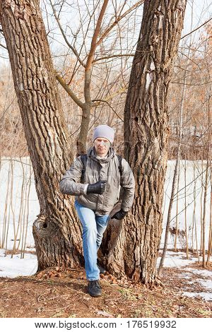 The Man In Spring Clothes Costs At A Tree