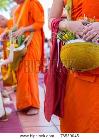 Offer sacrifice flowers to monk, Buddhist  religion