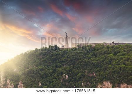 Statue of Liberty, Gellert hill, Budapest, Hungary. Panorama of the city with a statue on the horizon