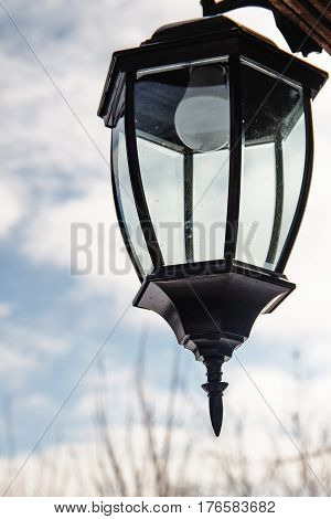 Street lamp in winter on sky background