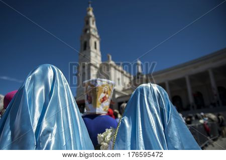 Fatima Portugal - May 13 2014: People at the Sanctuary of Fatima during the celebrations of the apparition of the Virgin Mary in Fatima Portugal.