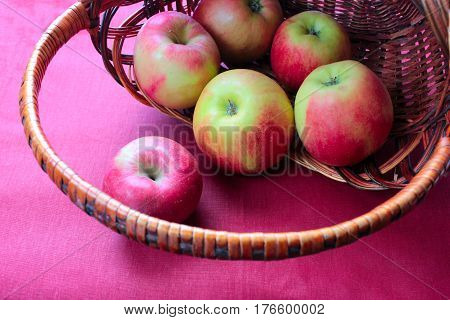 apple red on rose background basket agriculture garden harvest taste fresh collection heap disorder tablet black