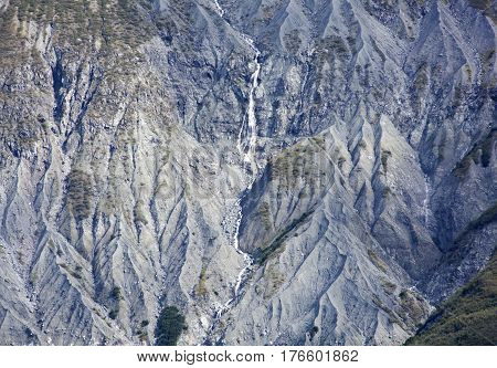The view of a small waterfall in Glacier Bay national park (Alaska).