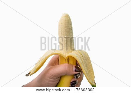 Hands peeling banana isolated on white background.