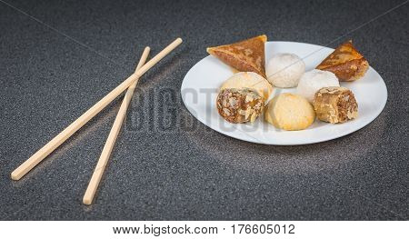 Delicious Assortment Of Homemade Asian Pastries. Samosas With A Rose Flower And Banana Balls
