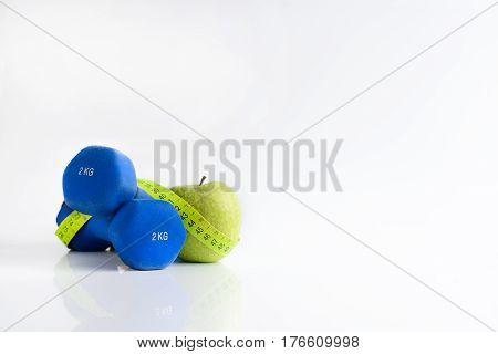 Dumbbell green apple and soft meter. sport and training