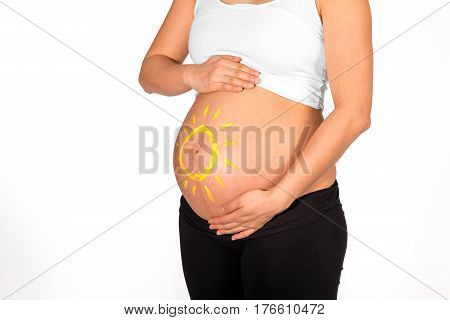 Yellow Sun Painted On Bare Belly Of Pregnant Woman