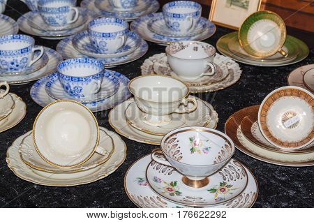 SOLINGEN NRW GERMANY - JULY 15 2015: Old porcelain cups with different design an antique shop