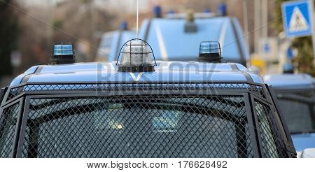 convoy with several police cars and armored vehicles during the uprising town