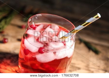 Glass of delicious wine spritzer on wooden table