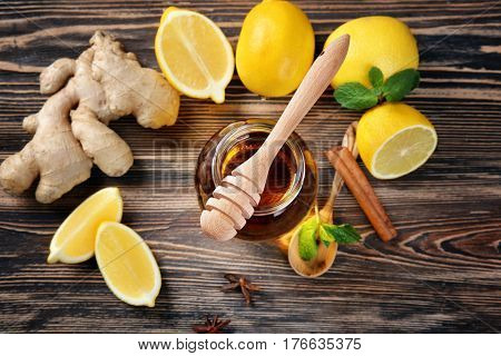 Natural ingredients for cough remedy on wooden background
