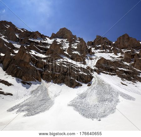 Snowy Rocks And Trace From Avalanche In Spring