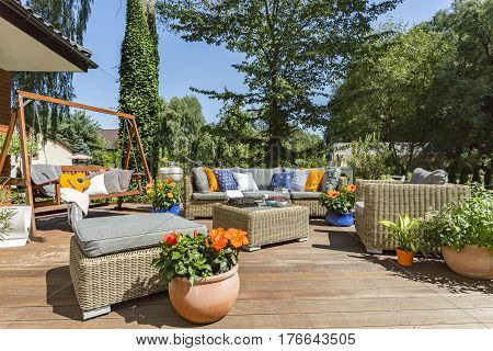 Spacious Villa Terrace With Rattan Furniture