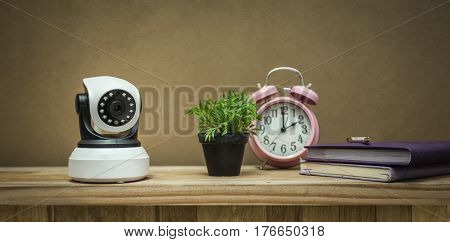 Security camera on Wood table. IP Camera.
