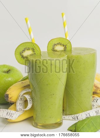 Fresh and healthy green smoothie with spinach,banana, kiwi and apple