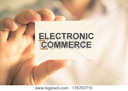 Businessman Holding Card With Ec Electronic Commerce Acronym Text