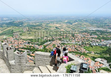 Tourists Enjoying The View From La Rocca Fortless On Borgo Maggiore, San Marino