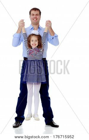 Happy young dad raise his beloved daughter's hands.Isolated on white background.