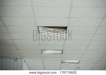 the construction of the ceiling, broken Ceiling light built-in white ceiling close-up diagonal view