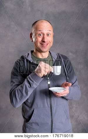 Young Baldheaded Man Drinking Coffee