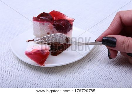 Slice of handmade cherry pie on a plate and classic espresso coffee in white background.
