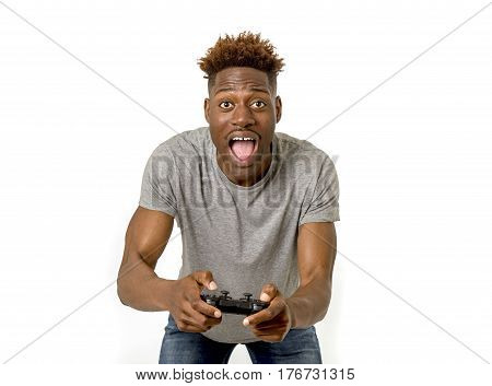 young attractive black afro american man using remote controller playing video game happy and excited having fun isolated on white background in gamin technology concept