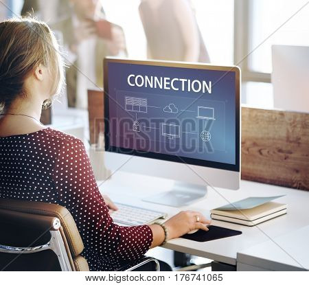 Woman using computer cloud network graphic overlay