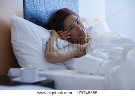 Young Happy Black Woman Lying In A Bed.