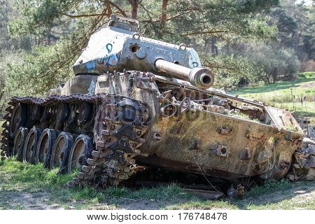 Battle tank in the moor of a forest