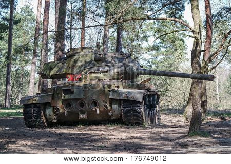 Battle tank in the moor of a forest